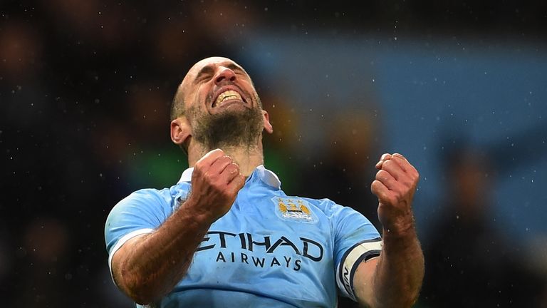 MANCHESTER, ENGLAND - JANUARY 27:  Pablo Zabaleta of Manchester City celebrates his team's 3-1 victory and progression to the final during the Capital One 