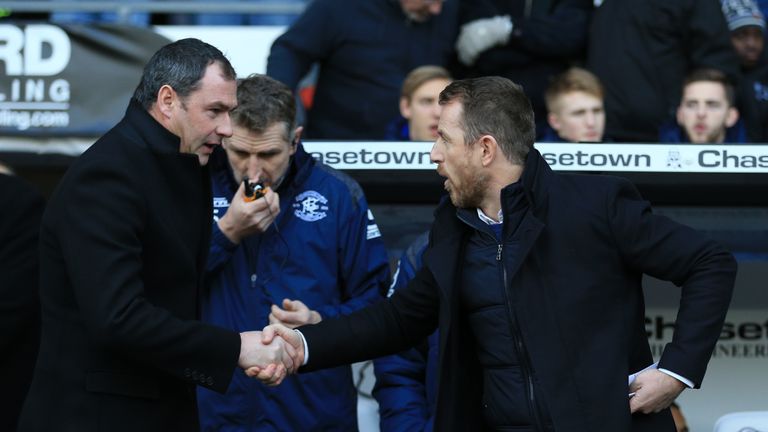 Derby County manager Paul Clement (left) and Birmingham City manager Gary Rowett shake hands.