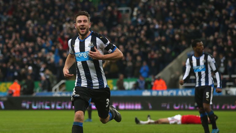 Paul Dummett of Newcastle United celebrates as he scores their third and equalising goal against Manchester United