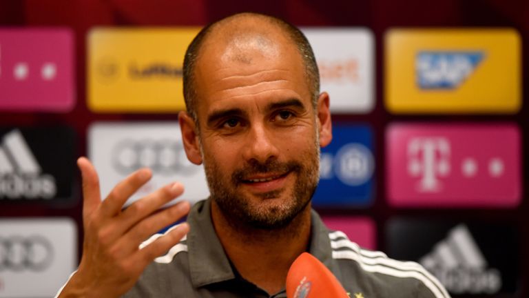 Head coach Pep Guardiola smiles during a press conference at day six of the Bayern Munich training camp at Aspire Academ in Doha, Qatar