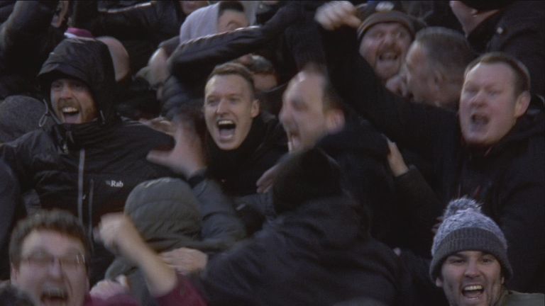 Phil Jones (c) celebrates wildly with the Manchester United fans after Wayne Rooney's strike