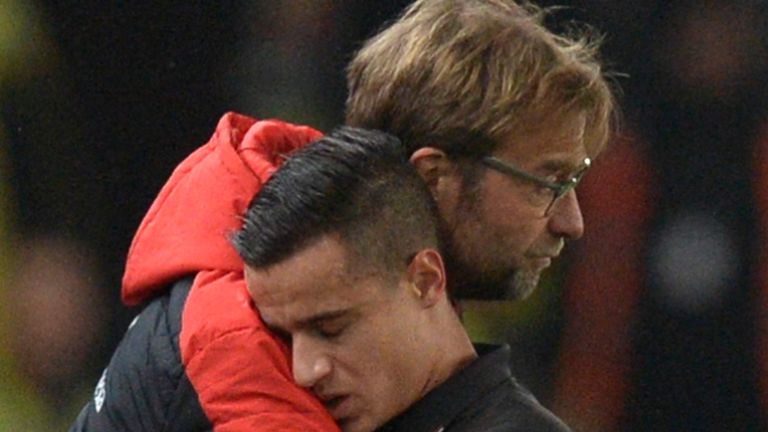 Liverpool's Philippe Coutinho (right) gets a hug from Jurgen Klopp after coming off injured