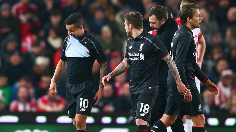Philippe Coutinho of Liverpool leaves the pitch due to injury 