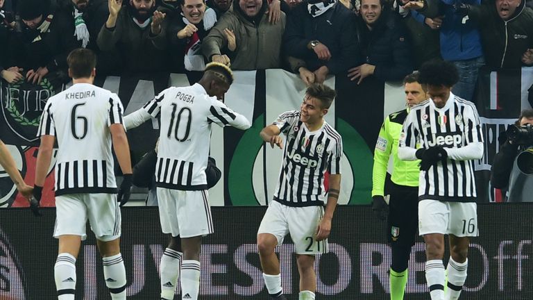 Juventus' forward from Argentina Paulo Dybala (C) celebrates with teammate Juventus' midfielder from France Paul Pogba
