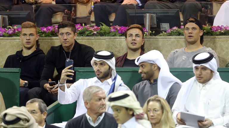 Bayern Munich's football team players Kimmich, Lewandowski, Gotze and Neuer watch Novak Djokovic of Serbia and Rafael Nadal in Qatar Open
