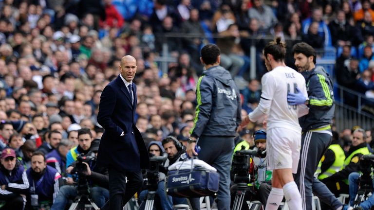 Real Madrid manager Zinedine Zidane looks on as Gareth Bale  leaves the pitch injured