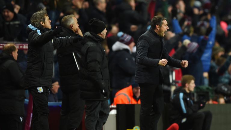 Remi Garde, manager of Aston Villa, (R) celebrates as Joleon Lescott scores their goal against Crystal Palace
