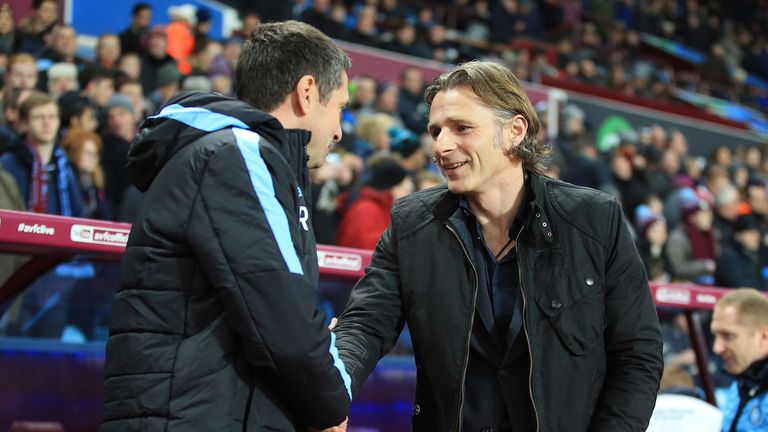 Remi Garde shakes hands with Gareth Ainsworth 
