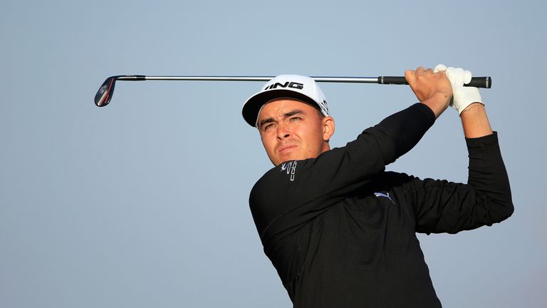 Rickie Fowler of the United States plays his tee shot at the par 3, 15th