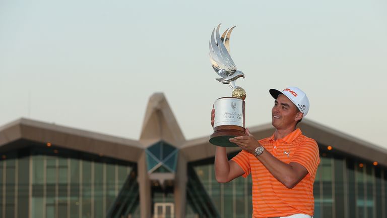 Rickie Fowler of the USA poses with the trophy after winning the Abu Dhabi HSBC Golf Championship