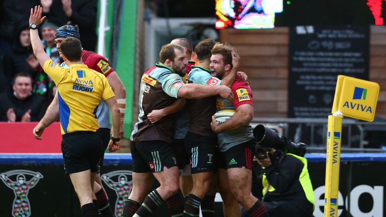 Rob Buchanan celebrates scoring a try with his Quins team-mates