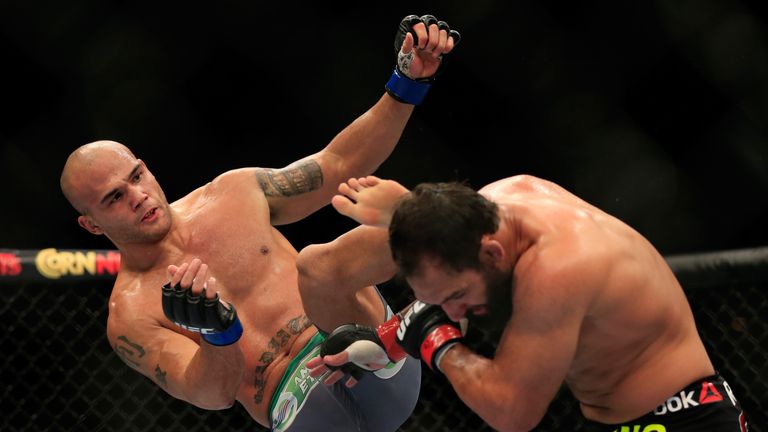 Robbie Lawler kicks Johny Hendricks in their welterweight title fight during the UFC 181 event at the Mandalay Bay Events Cen