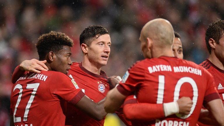 Bayern Munich's players (L-R) David Alaba, Robert Lewandowski and Arjen Robben celebrate 
