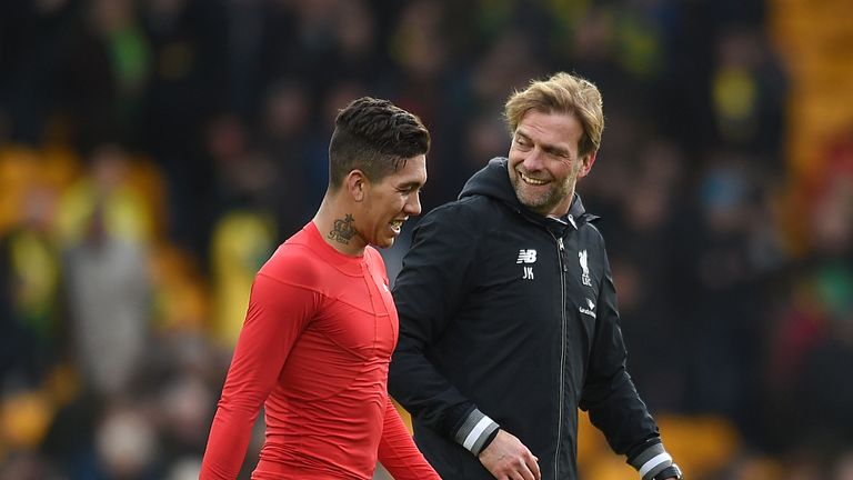 Liverpool manager Jurgen Klopp (right) celebrates with Roberto Firmino