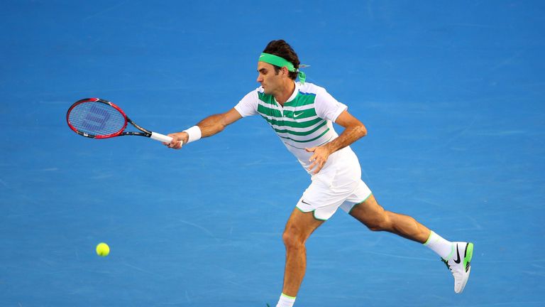Roger Federer of Switzerland plays a forehand in his first round match against Nikoloz Basilashvili