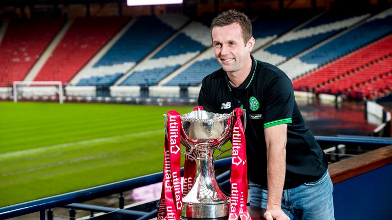 Celtic manager Ronny Deila prepares to take on Ross County in the Scottish League Cup Semi-Final, pictured with trophy