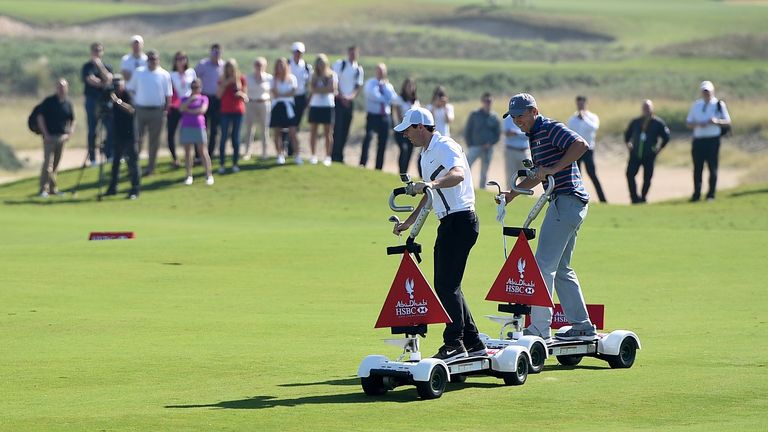 Spieth and McIlroy collided on the fairway, but both stayed on their GolfBoards