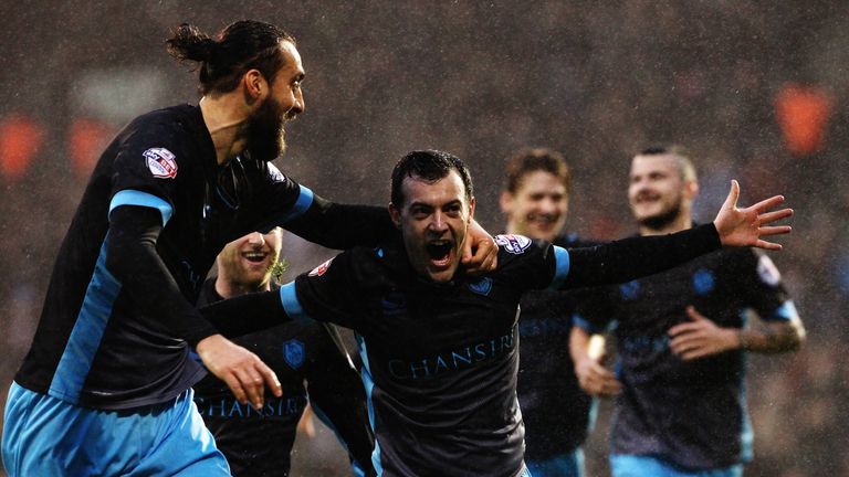 Ross Wallace (R) of Sheffield Wednesday celebrates with team-mate Atdhe Nuhiu after scoring a screamer at Fuljam