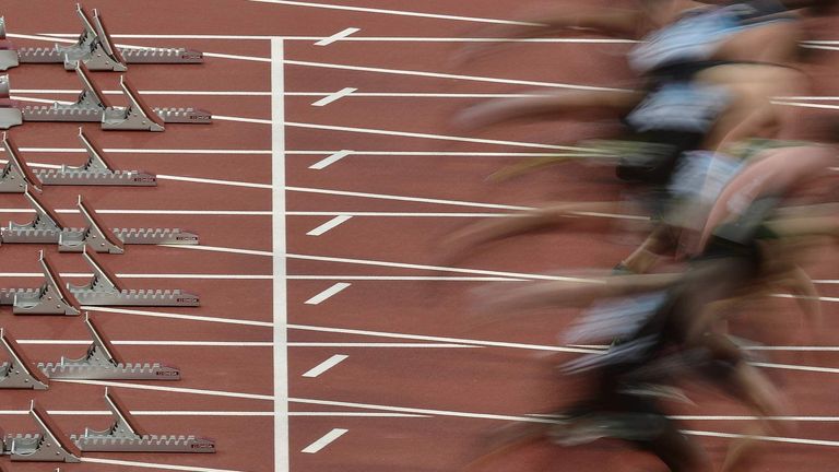 Runners start during a men's 100m heat at the BUCS Outdoor Athletics Championships at the Olympic Stadium in London