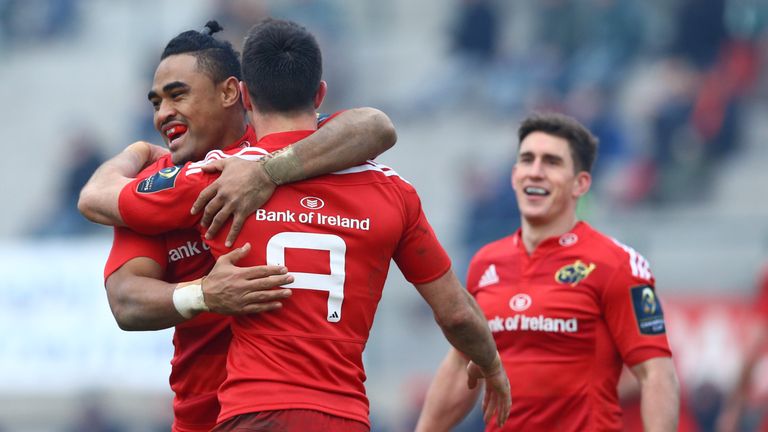 Conor Murray (No 9) is congratulated by Francis Saili after scoring Munster's third try