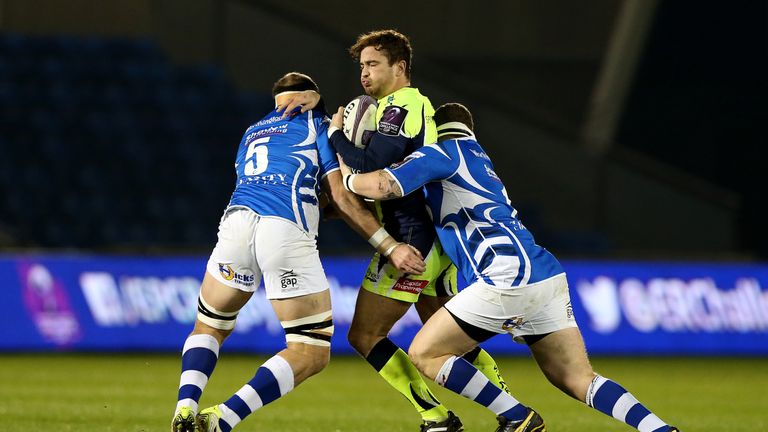 Danny Cipriani is tackled by Dragons duo Phil Price (right) and Rynard Landman (left)