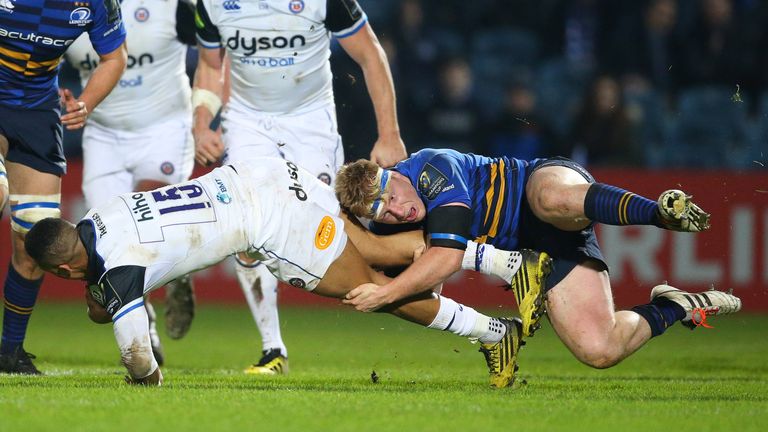 Bath’s Anthony Watson is tackled by Leinster’s James Tracy