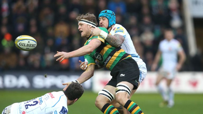 Jamie Gibson passes the ball under pressure from Exeter's Jack Nowell