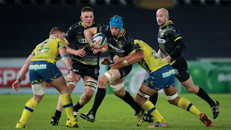 Ospreys flanker Justin Tipuric is tackled by Clermont's Fritz Lee