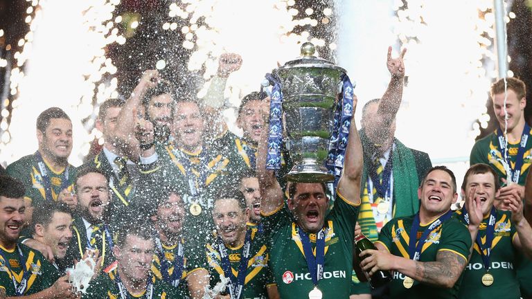 MANCHESTER, ENGLAND - NOVEMBER 30:  Cameron Smith the captain of Australia lifts the winners trophy after his sides 34-2 victory during the Rugby League Wo