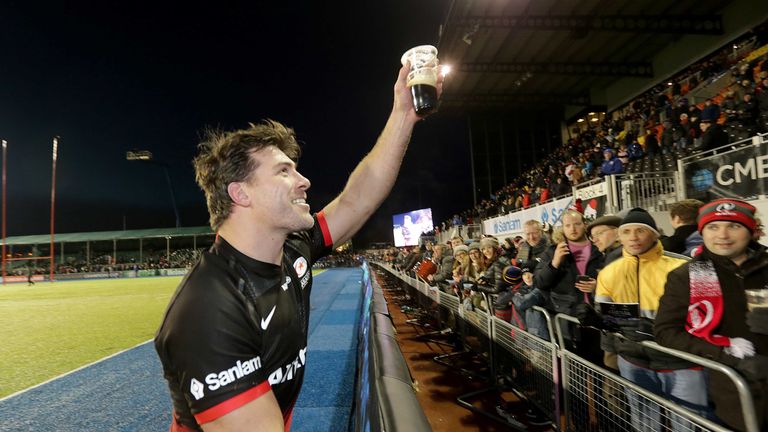 Schalk Brits takes a pint from someone in the crowd after Saracens' win over Ulster