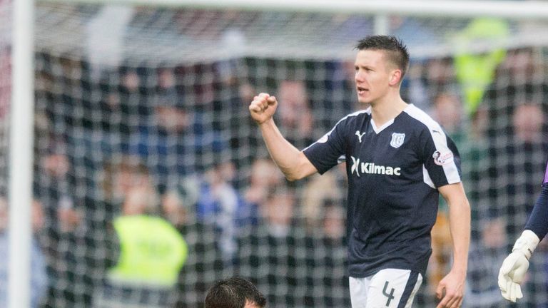 Dundee United's Ryan McGowan (left) sits dejected 