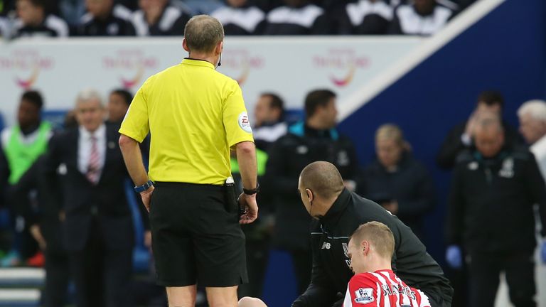 Ryan Shawcross lies injured before being replaced during the defeat to Leicester. 