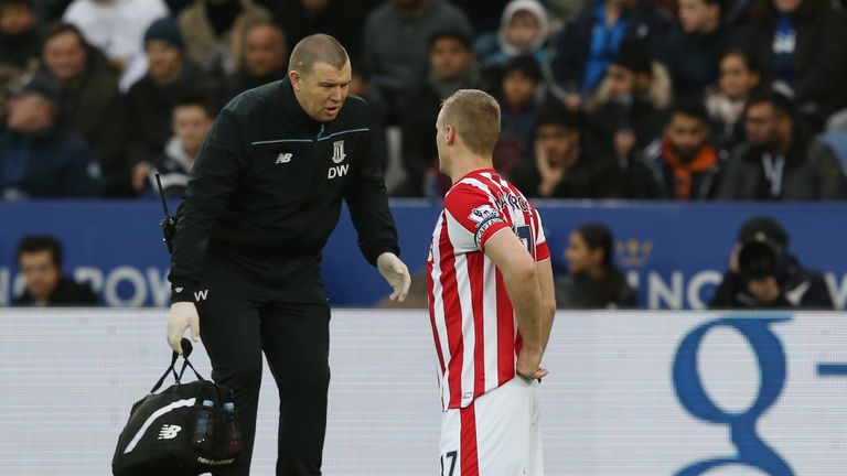 Ryan Shawcross of Stoke City talks with a medical staff member
