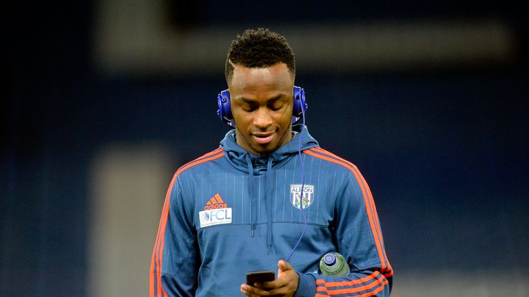 Saido Berahino of West Bromwich Albion walks on the pitch wearing headphones before the Premier League match against Chelsea at Stamford Bridge 