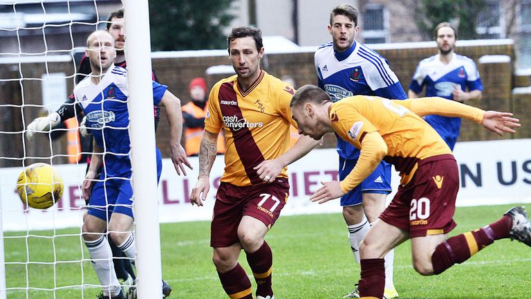 Scott McDonald looks on as Louis Moult stoops to score Motherwell's first goal