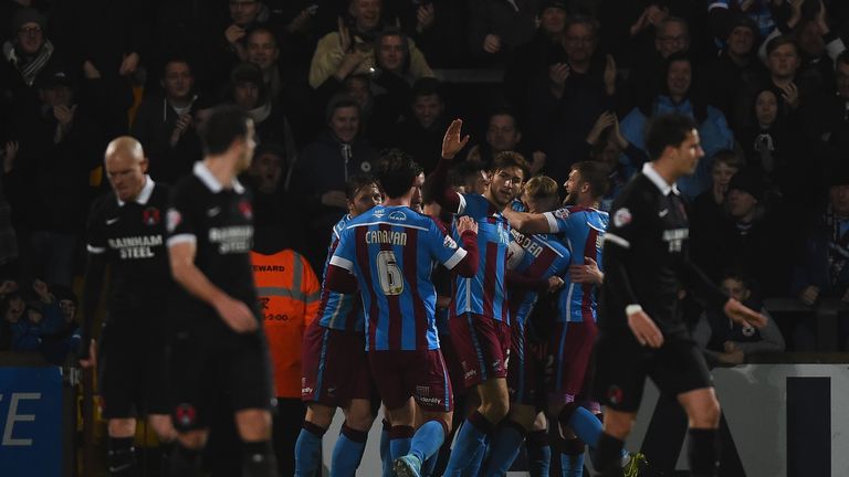 Scunthorpe United celebrate the first goal an own goal by Jean-Yves M'Voto of Leyton Orient during The Emirates FA Cup S