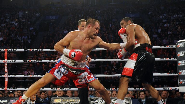 Sergey Kovalev (left) land a body punch on Jean Pascal during their light heavyweight championship bout