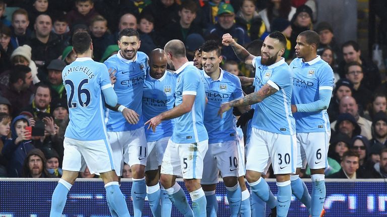  Sergio Aguero (C) of Manchester City celebrates scoring his team's first goal with his team mates during the Emirates FA Cup