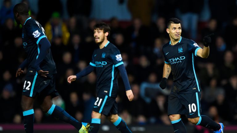 Sergio Aguero (right) celebrates scoring Manchester City's first goal from the penalty spot