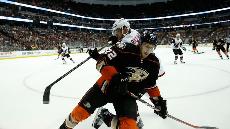 ANAHEIM, CA - OCTOBER 14:  Brad Richardson #12 of the Arizona Coyotes battles for a loose puck with Shawn Horcoff #22 of the Anaheim Ducks  during the firs