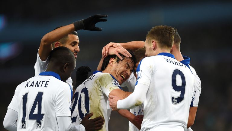 Shinji Okazaki of Leicester City celebrates scoring his team's first goal with his team-mates during the Barclays Premier League match at Aston Villa