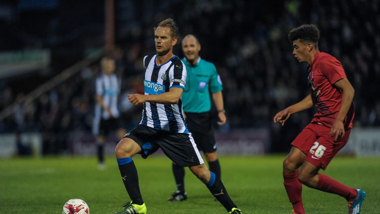 Siem de Jong of Newcastle runs with the ball whilst Ben Godfrey of York City looks to challenge in a pre-season friendly