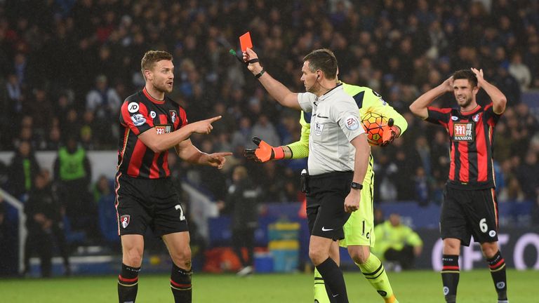 Simon Francis (L) of Bournemouth is shown a red card by referee Andre Marriner after fouling Leicester's Jamie Vardy