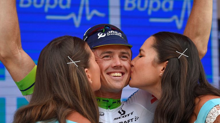Simon Gerrans (C) from the Orica Greenedge receives a kiss as he celebrates on the podium following his victory in stage four of the Tour Down Under