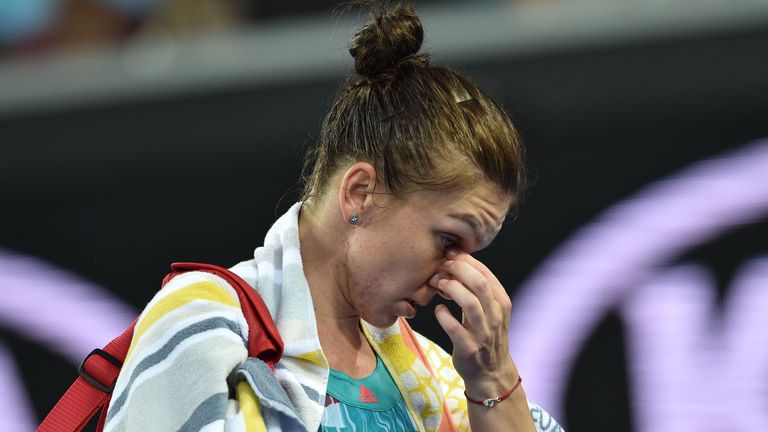 Romania's Simona Halep leaves the court after her shock first-round loss at the Australian Open