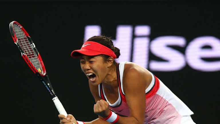 Shuai Zhang celebrates her stunning win over Simona Halep