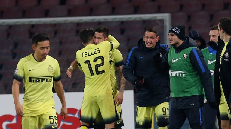 Jovetic celebrates his strike at the San Paolo with Alex Telles