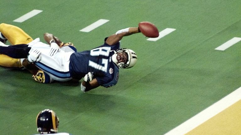 Titans wide receiver Kevin Dyson stretches for the end zone but falls short as he is tackled by St. Louis Rams linebacker Mike Jones