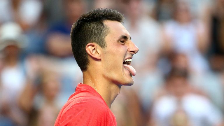 Bernard Tomic looks on in his first round match against Denis Istomin