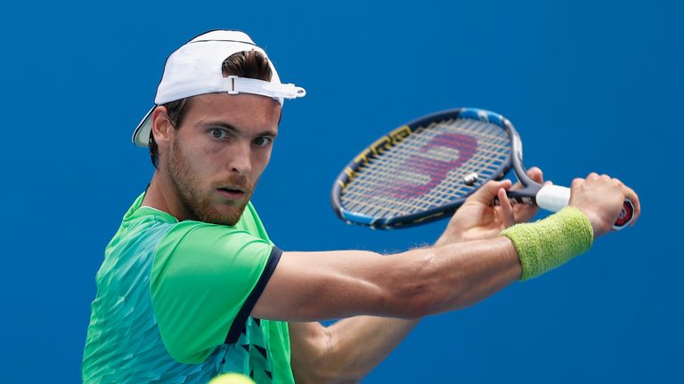 Joao Sousa plays a backhand in his match against Mikhali Kukushkin at the 2016 Australian Open